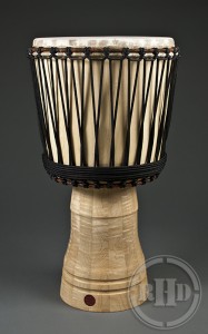 Rhythm House Drums "stave" djembe made from pieces of wood glued together. I have not played one yet but my friend Jason loves his!