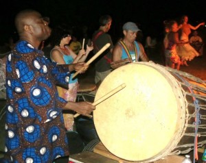 Having fun with djembe and an extra large drum at an exciting Florida evening jam session