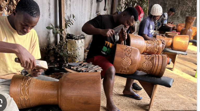 Drum carvers in Guinea West Africa